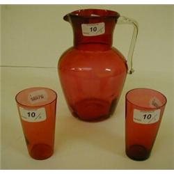 A Cranberry Glass Jug, and two beakers (3) £100 - 120...