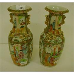 A Pair of 19th Century Cantonese Vases, decorated figures in enamel colours, 25.5 cm £30 - 50...
