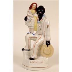 A Victorian Staffordshire Pottery Group, Uncle Tom, 27 cm  See illustration £50 - 80...