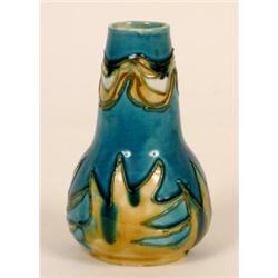 A Mintons Secessionist Vase, with tube line decoration, number 42, 13.5 cm  See illustration £40...