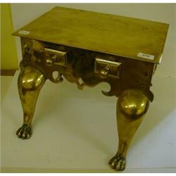 A Brass Footman, with two dummy drawers, and paw front feet, 40 cm £30 - 50...