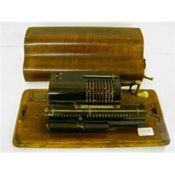 A Muldivo Calculator, in an oak travelling case, 39 cm £20 - 30...