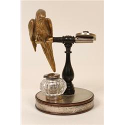 A Late Victorian Novelty Desk Stand, in the form of a parrot, with a claw out stretched to hold a...