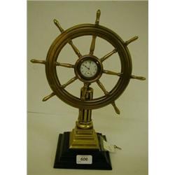 A Ship's Wheel Timepiece, with seconds dial, on a fluted column and stepped square base, 36 cm £1...