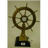 Image 1 : A Ship's Wheel Timepiece, with seconds dial, on a fluted column and stepped square base, 36 cm £1...