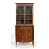 Image 1 : An Edwardian Mahogany Cabinet, the upper section having a pair of bar glazed doors above a bow fr...