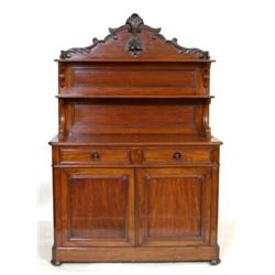 A Victorian Mahogany Chiffonier, with fruit and scroll carved pressed rail above two shelves, the...