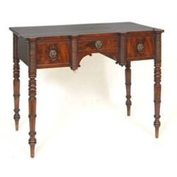 An Early 19th Century Scottish Mahogany Side Table, having a central drawer flanked by a pair of...
