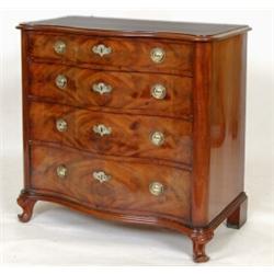 A 19th Century Continental Mahogany Serpentine Front Dressing Chest, of four graduated long drawe...