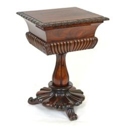 A William IV Rosewood Teapoy, the hinged lid with leaf carved and gadroon edging, the underside v...