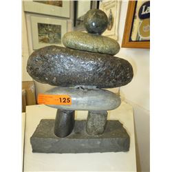 Stone Inukshuk statue