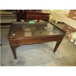 Small vintage wood coffee table with glass top