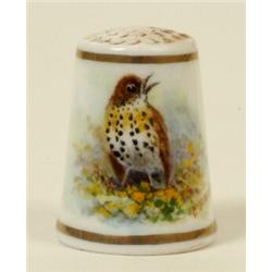 A Royal Worcester Porcelain Thimble, painted a thrush by Barker, puce printed mark  See illustrat...