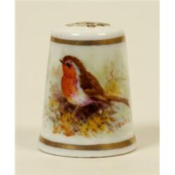 A Royal Worcester Porcelain Thimble, painted a robin by Powell, puce printed mark  See illustrati...