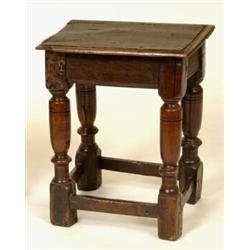 A Joined Oak Stool, the rectangular top on tapering turned legs joined by stretchers  See illustr...