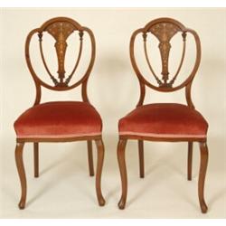 A Set of Four Late Victorian Inlaid Mahogany Chairs, of Hepplewhite design, on cabriole front leg...