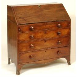 A George III Mahogany Bureau, the fall front revealing a fitted interior above four graduated lon...