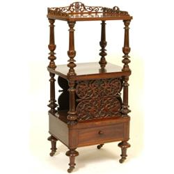 A Victorian Rosewood Canterbury Whatnot, with a pierced 3/4 gallery, having two tiers on turned a...