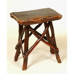 A 19th Century Vernacular Table, the elm top on branch supports joined twig stretchers, 39 cm  Se...