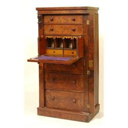 A Victorian Walnut Secretaire Wellington Chest, having two short drawers above two false drawers...