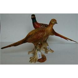 A Brace of Spode Pheasants, perched on logs (2) £100 150...