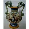 Image 1 : An Italian Maiolica Baluster Vase, with serpent handles, 23 cm £20 30...