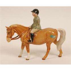 A Beswick Group, boy on pony, palomino, 1500  See illustration £80 150...