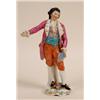 Image 1 : A Porcelain Figure of a Gentleman, wearing a purple coat, on a floral encrusted base, gold anchor...