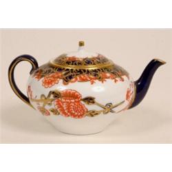 A Royal Crown Derby Miniature Tea pot and Cover, decorated in the Imari taste  See illustration £...