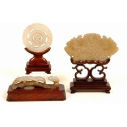 A Carved and Pierced Jade Roundel, with central moving wheel, on stand, and a similar carving of...