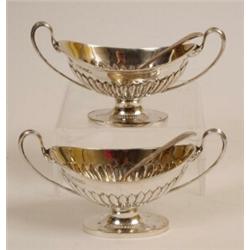 A Pair of Victorian Silver Two Handled Salts, with reeded lower bodies, and a pair of spoons, Lon...