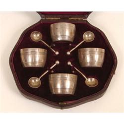 A Set of Four Victorian Silver Barrel Shaped Salts, with spoons, London 1880, cased  See illustra...