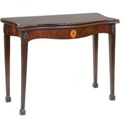 A George III Serpentine Mahogany Tea Table, with inlaid frieze, on square tapering legs  See illu...