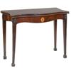 Image 1 : A George III Serpentine Mahogany Tea Table, with inlaid frieze, on square tapering legs  See illu...