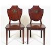 A Pair of George III Mahogany Hall Chairs, the shield shape backs painted crests, on square taper...