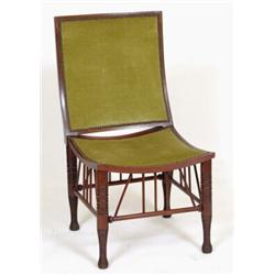 A Liberty Style Mahogany Thebes Chair, with a shaped upholstered back and seat, on turned legs  S...