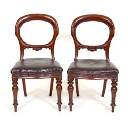 A Set of Six Victorian Mahogany Dining Chairs, with oval backs upholstered seats and turned front...