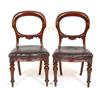 A Set of Six Victorian Mahogany Dining Chairs, with oval backs upholstered seats and turned front...