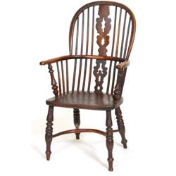 A Victorian Yew Beech and Elm Windsor Style Armchair, with Christmas tree pierced splat, on turne...