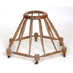 A 19th Century Beech Baby Walker, with turned spindles  See illustration £100 150...