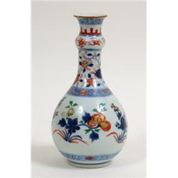 A Chinese Pear Shaped Vase, with knopped stem, decorated flowers in underglaze blues and reds, 24...