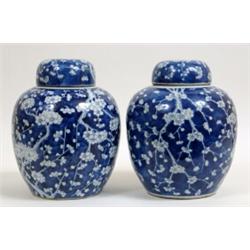 A Pair of Chinese Ginger Jars and Covers, decorated prunus in underglaze blue, four character mar...
