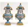 Image 1 : A Pair of Late 19th Century Sevres Style Vases and Covers, decorated flowers in a gilt border on...