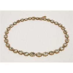 A Ladies Yellow Metal Necklace Set 34 Graduated Oval Beryls, with 9ct gold safety chain £ 700 - 9...