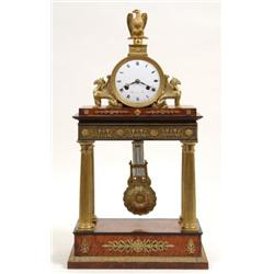 A French Empire Portico Clock, the circular enamel dial signed "Barnou a paris" with Roman numera...