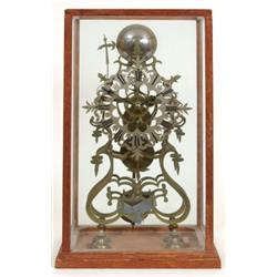 A 19th Century Brass Scroll Frame Skeleton Clock, with pierced silver chapter ring with Roman num...