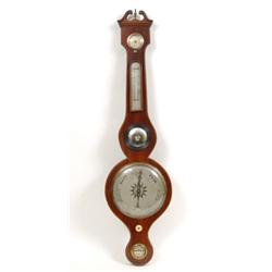 A 19th Century Wheel Barometer, with hydrometer, thermometer, witches glass and level, by Simmons...