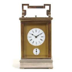 A Carriage Clock, the enamel dial with Roman numerals above an alarun dial behind an engraved bra...