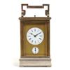 Image 1 : A Carriage Clock, the enamel dial with Roman numerals above an alarun dial behind an engraved bra...