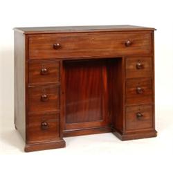 An Early 19th Century Mahogany Secretaire Chest, the secretaire drawer above a recessed cupboard,...